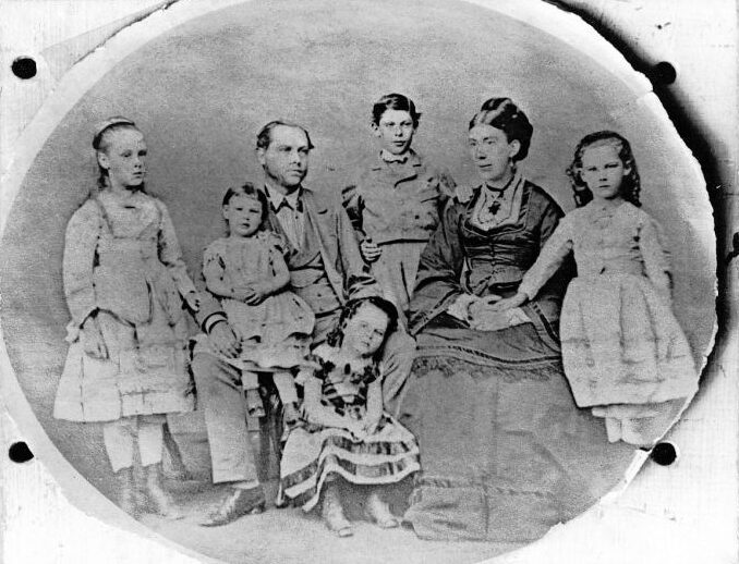 Tom & Mary Saull who are my Grandparents. Father & Mother with Five Children Taken about 1876. Amy, Grandpa Saull, Fred Saull, Grandma Saull, Edith (Griffen). Gertrude (Kilburn) on Grand Pa’s knee. Seated – Alice Maude (Hardie) Born 1871. Granny Hardies Father & Mother