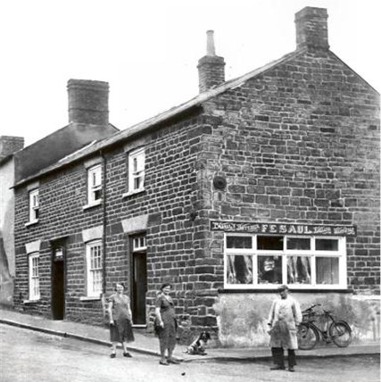 Cecile Saul, her daughter Kathleen Saul and an employee out front of the shop circa 1930
